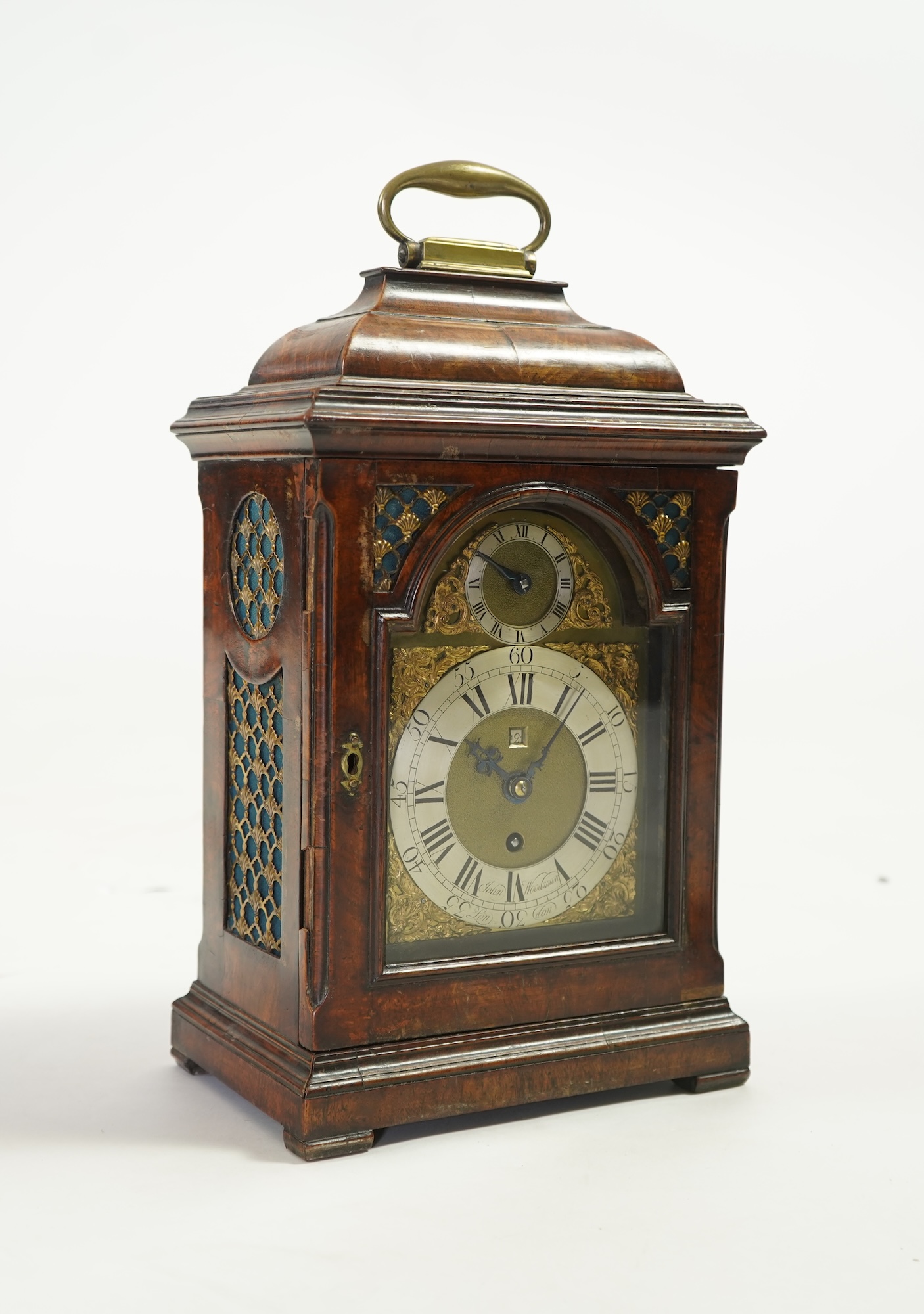 A George II walnut and brass mounted bracket clock, signed John Woodman
